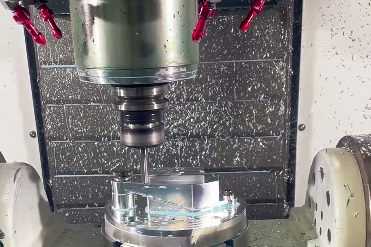 Real machining setup with external coolant nozzles arranged around the spindle above an accessible workpiece