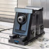A vise and zero-point clamping modules on a machining-center table