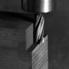 A roughing cutter milling a graphite block