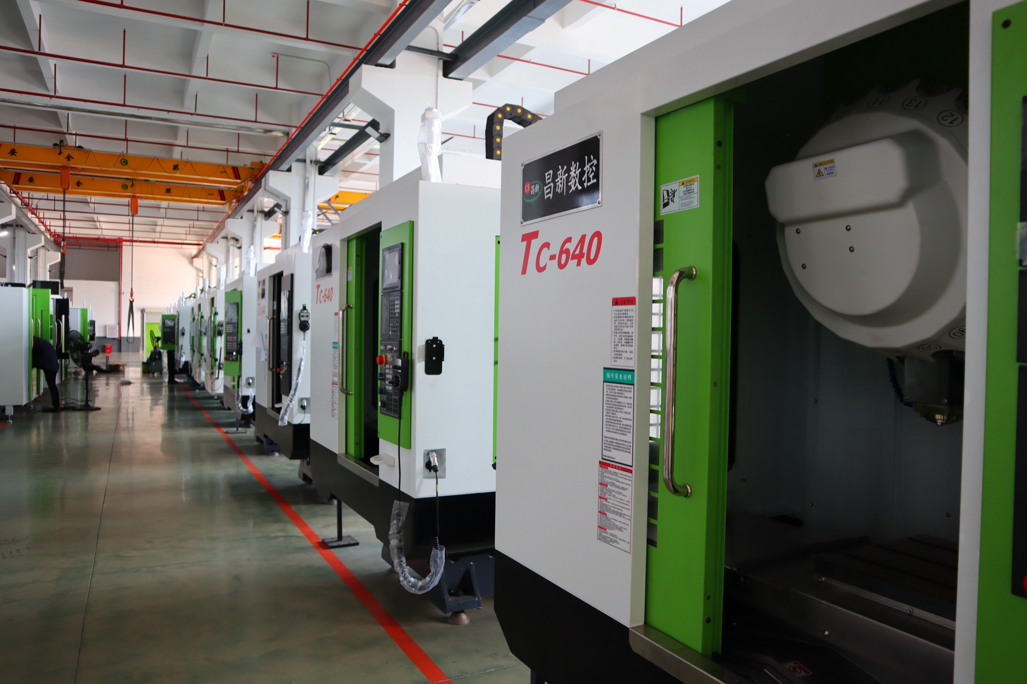 Row of CHANSIN CS-T6 drill-tap centers, formerly sold as TC-640, on the production floor