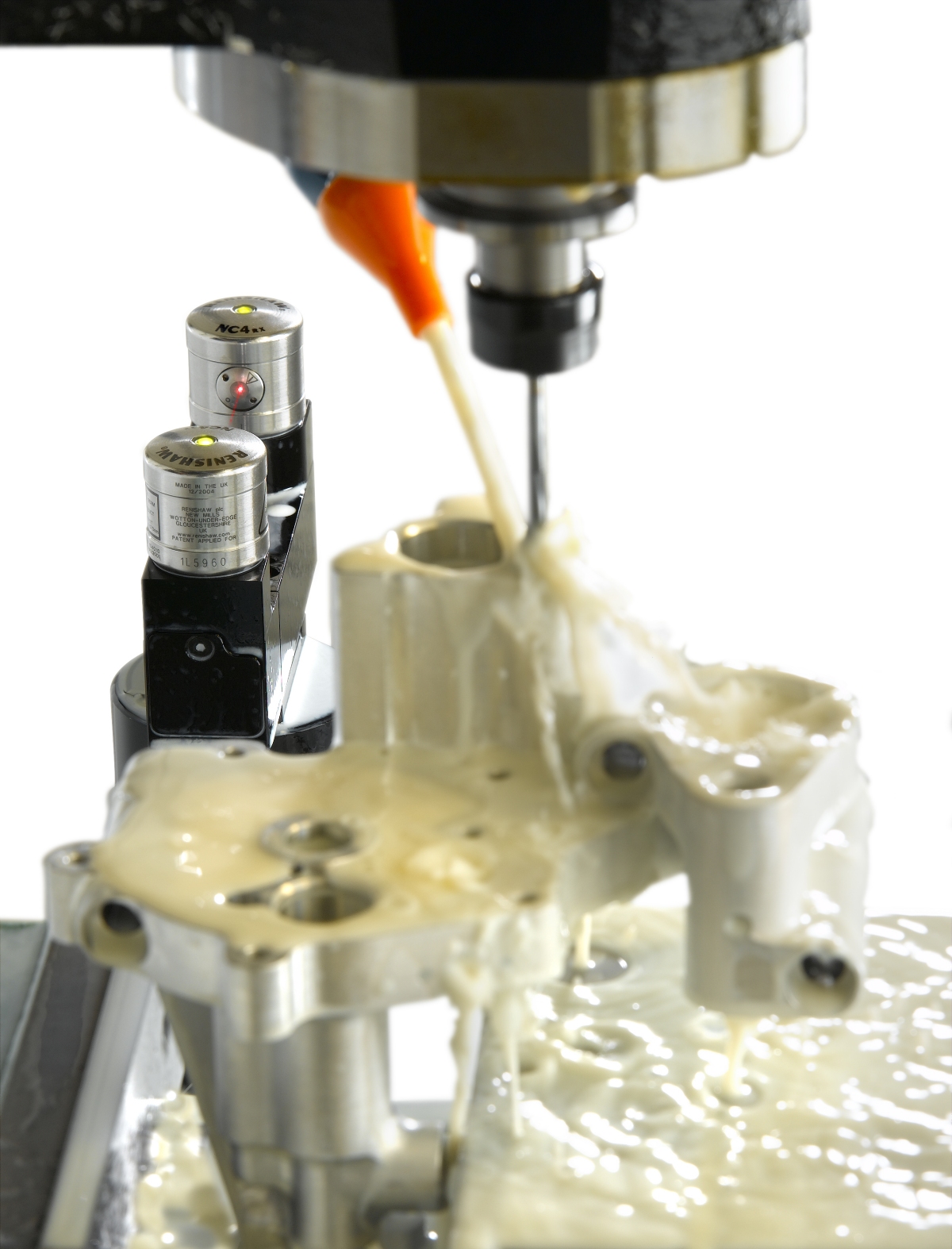 Non-contact tool measurement inside a machine with coolant present