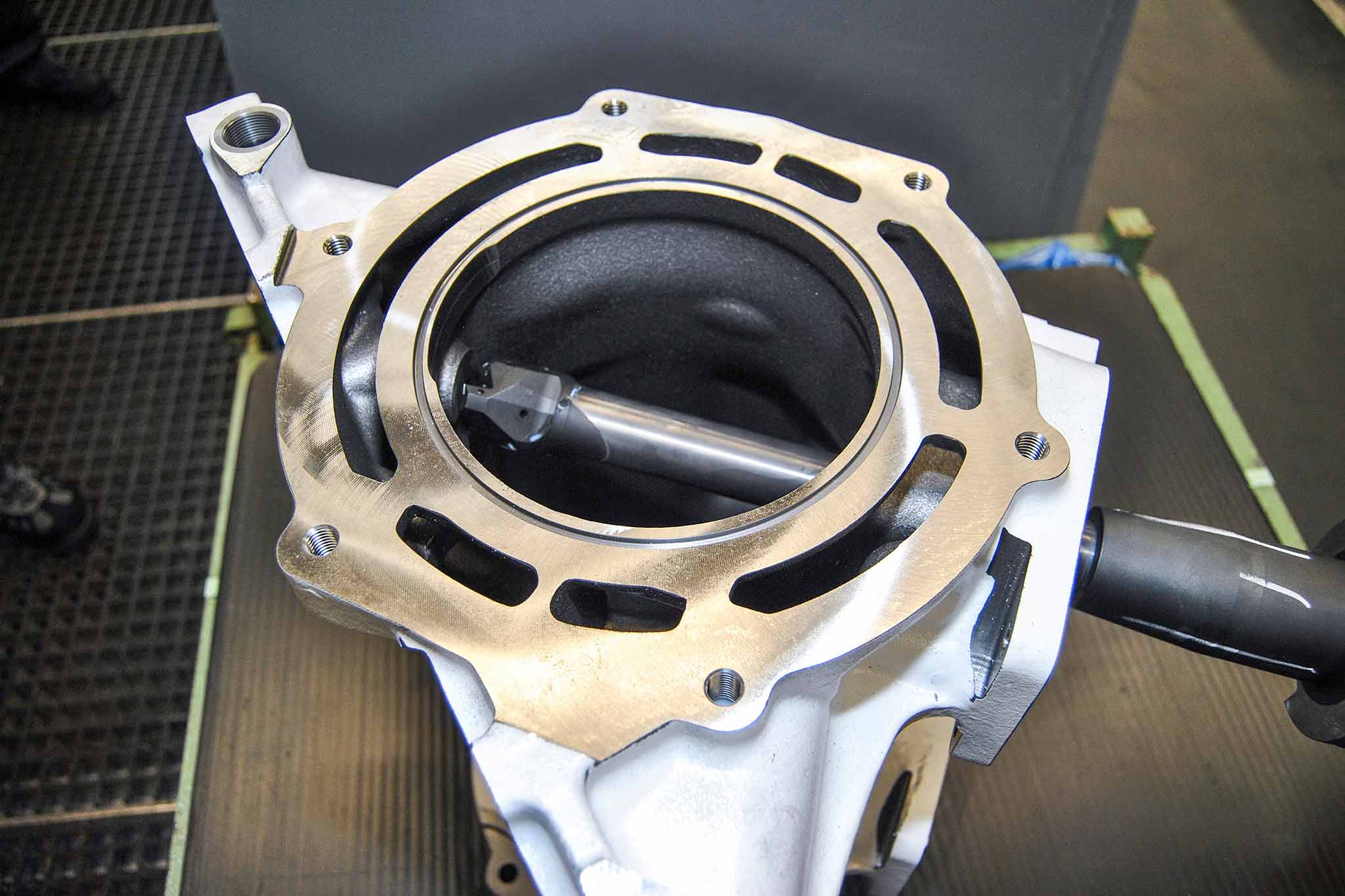 A milling tool inside a gray-cast-iron housing